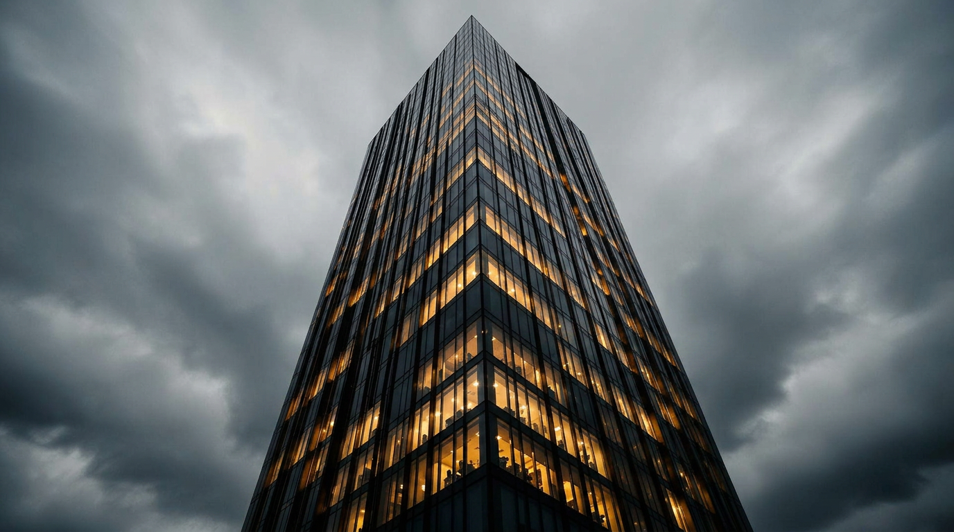 Modern black-glass high-rise towers at night